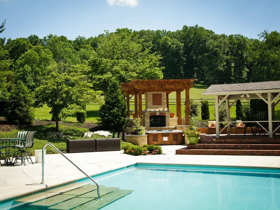 The outdoor pool, with its pergola and loungers on the terrace.